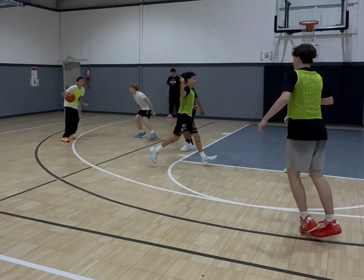 Players running a 3v3 game on the Liberty Hill Athletics court